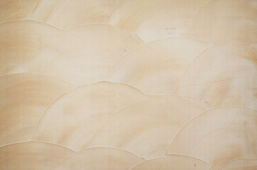 Champagne beige trowel wavy stucco texture background. Japanese modern style mortar and cement...