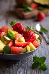 Fruit salad with cut fresh fruit and mint