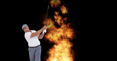 Caucasian senior male golf player swinging club against fire flame effect on black background
