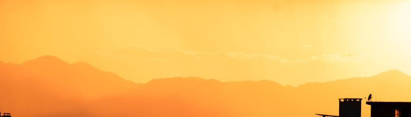 Mountains shape at sunset sky. Relaxing mountain landscape with colorful sunset, nature outdoor travel background.