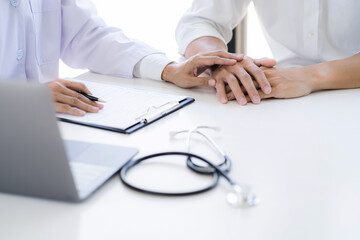 Doctor with patient consultation in medical office. Visiting Physician concept
