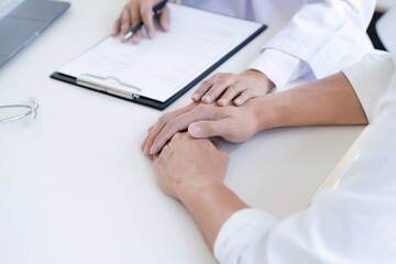 Doctor with patient consultation in medical office. Visiting Physician concept