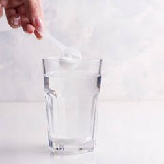 Female hand preparing a drink for athletes. White background