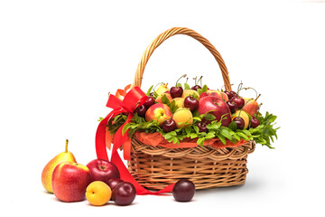 Basket with fresh fruits and berries on a white background