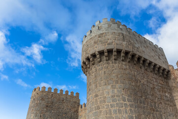 Fototapeta na wymiar Detailed view of Ávila city Walls and fortress tower, blue sky as background