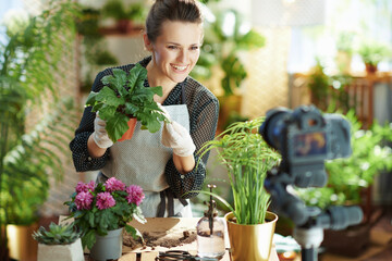 happy woman records gardening educational video tutorials