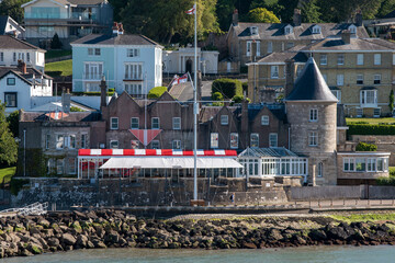 Cowes, Isle of Wight, England, UK. 2021. An exterior view of the prestigious Royal Yacht Squadron clubhouse and Castle at West Cowes, Isle of Wight, UK - obrazy, fototapety, plakaty