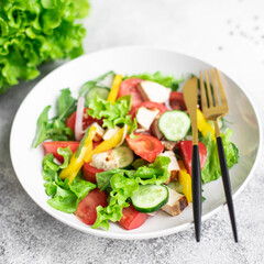 vegetable salad and chicken meat vegetables fresh tomato, cucumber, pepper organic dish on the table healthy food meal snack copy space food background rustic. top view
