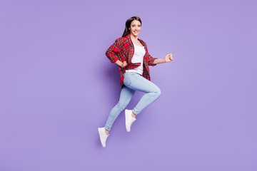 Fototapeta na wymiar Full size profile photo of nice brunette hairdo young lady run wear red shirt jeans isolated on purple color background