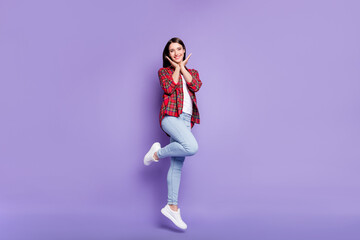 Fototapeta na wymiar Full size photo of funny long hairdo young lady stand wear shirt jeans isolated on violet color background