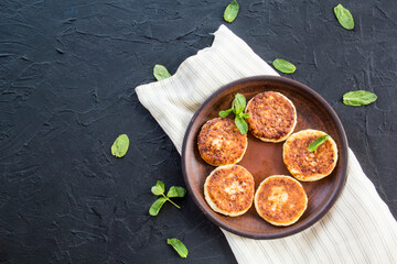 A healthy breakfast of cheese pancakes and honey. Creative atmospheric decoration