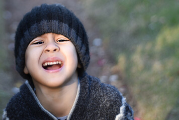 portrait of little boy crying In The Park with blurred background
