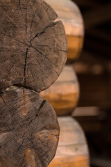 wooden cross section of Countryside house.
Partly wall of old house from wooden logs with cracks....