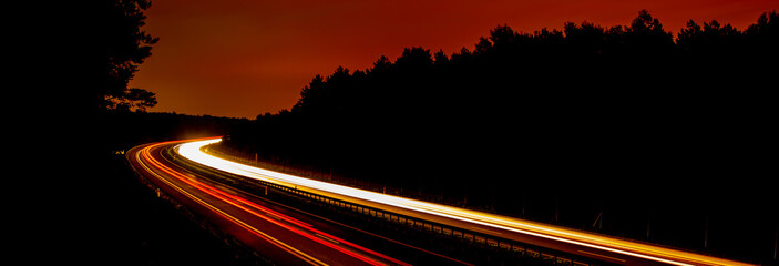 Night road lights. Lights of moving cars at night. long exposure