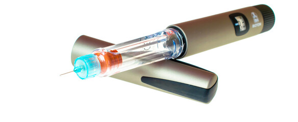 Insulin pen injector.  Insulin pen fill with needle on white background. Diabetes Day.