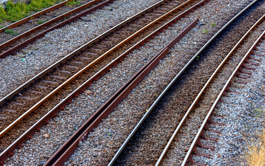 Fototapeta na wymiar Old rusty train tracks that cross the city in Belo Horizonte, Minas Gerais, Brazil