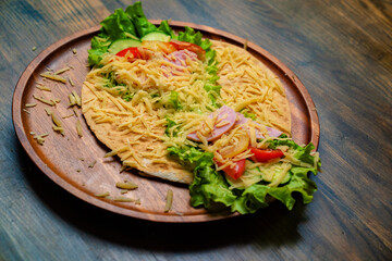 pita with vegetables and cheese. vegetarian roll.