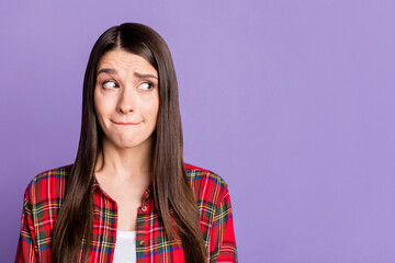 Fototapeta premium Photo of scared brunette hairdo millennial lady look empty space wear red shirt isolated on purple color background