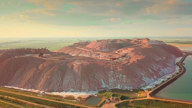 Production of potash fertilizers, waste potash fertilizers, bird's-eye view. Shooting at the drone of Belaruskali, a plant for the extraction of potash ore in Soligorsk at sunset.