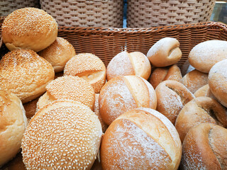 Bakery products such as bread, croissants, pies, sandwiches,tart and many items are placed on trays to prepare for sale in a bakery shop.