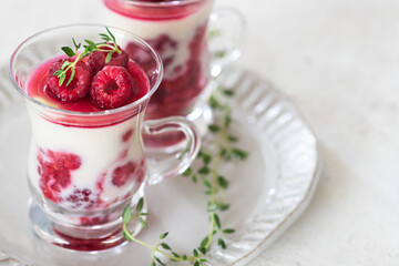 Healthy breakfast: yogurt parfait with fresh raspberries	