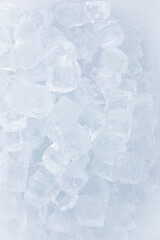 Fototapeta na wymiar Ice background. Top view of small ice cubes.
