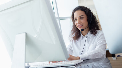 Beautiful woman wearing headsets worker call centre. working customer support service operator. communication in corporate, Business advisor concept.