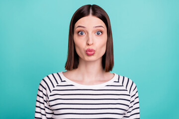 Fototapeta premium Photo of romantic cute pretty lady lips send air kiss wear striped shirt isolated on teal color background