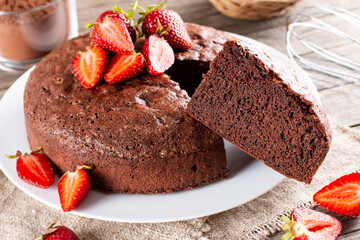 Chocolate sponge cake with strawberry on a table