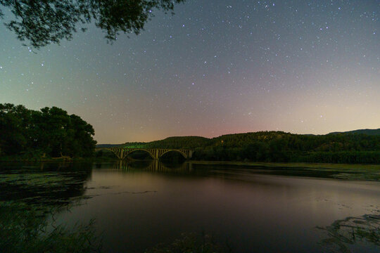 Starry sky over the calm lake