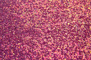 Abstract pink bright background with multicolored sparkles. Festive concept. Flat lay