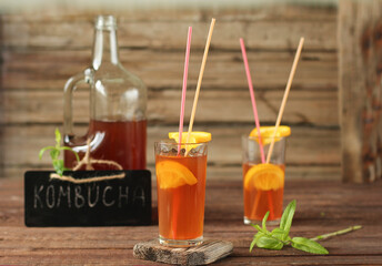 Fermented glass glasses of tea kombucha with fresh оrange