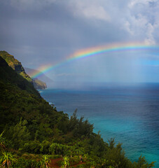 a view of a colorful rainbow with spectacular views of the Kalalau in Kauai, Hawaii, USA.