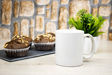 homemade chocolate nuts muffins on blackboard and mockup cup for your product or your logo