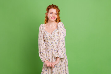 Photo of attractive pretty nice young woman good mood wear floral print dress isolated on green color background