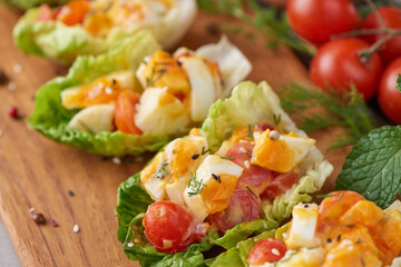 Diet menu. Healthy salad of fresh vegetables - tomatoes, egg, Onion. high angle view of a nutritious vegetable salad with boiled egg slices, served.  Healthy meal concept.