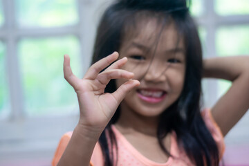 A 5-year-old Asian girl broke her first tooth.