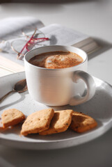 cup of coffee with cookies