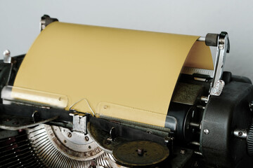 typewriter on table, words fake news are printed on paper in large size, vintage lantern shines, retro style, concept of information hoax in social media, misleading, exposing deception, old school