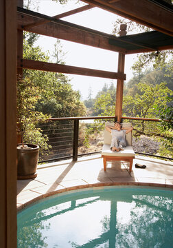 Woman relaxing at luxury resort in forest