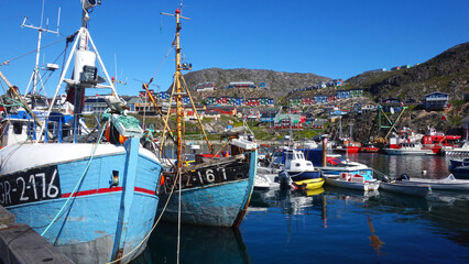 fishing boats in the harbor, Picturesque harbor with colorful houses and fishing boats, Qaqortoq,...