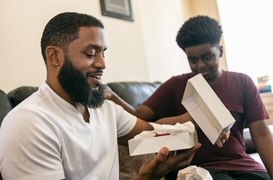 Father Opens Gift From Son 