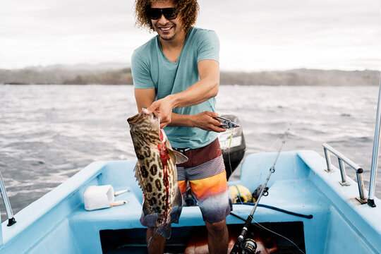 Happy Fisherman Holding Fish