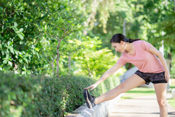 Naklejka na ściany i meble Asian women stretching and warm up before exercise