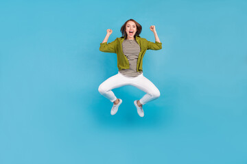 Fototapeta na wymiar Full size photo of cheerful happy young woman winner lucky lady celebrate isolated on blue color background