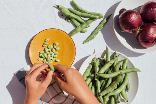 Peeling peas 
