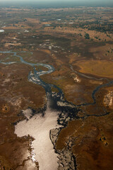 Fototapeta na wymiar Aerial view of a small part of the Okavango Delta in northern Botswana, Africa. All the water reaching the delta is ultimately evaporated and transpired and does not flow into any sea or ocean.