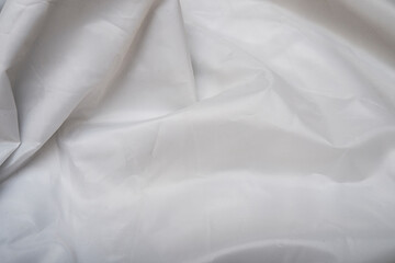 White silk making a background for the banner
