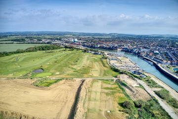 Aerial view over Littlehampton and the links Golf Course next to the River Arun in this popular tourist destination.