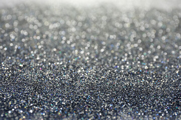 Shiny silver glitter as background. Bokeh effect